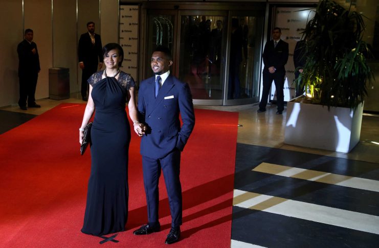 Cameroon soccer player Samuel Eto’o and his wife Georgette pose for photographers as they arrive to the wedding of Argentina soccer player Lionel Messi and Antonela Roccuzzo in Rosario