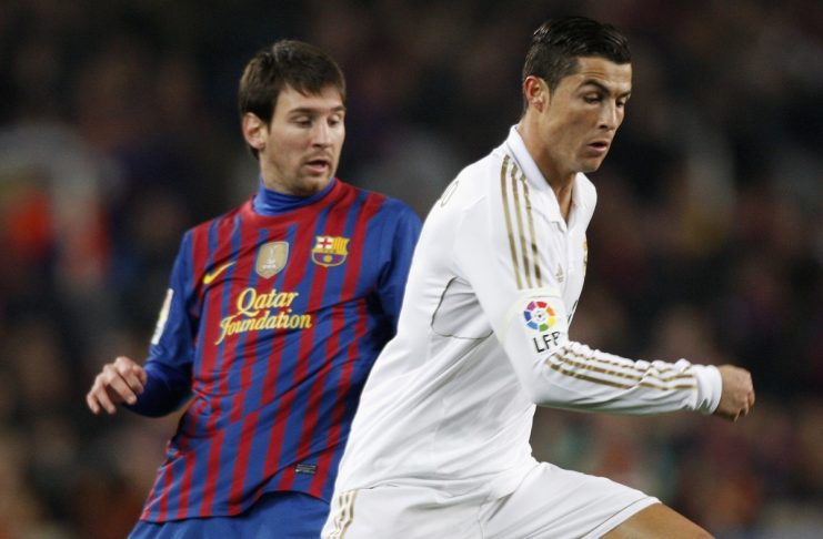 Barcelona’s Messi and Real Madrid’s Cristiano Ronaldo challenge during their Spanish King’s Cup quarter-final soccer match in Barcelona