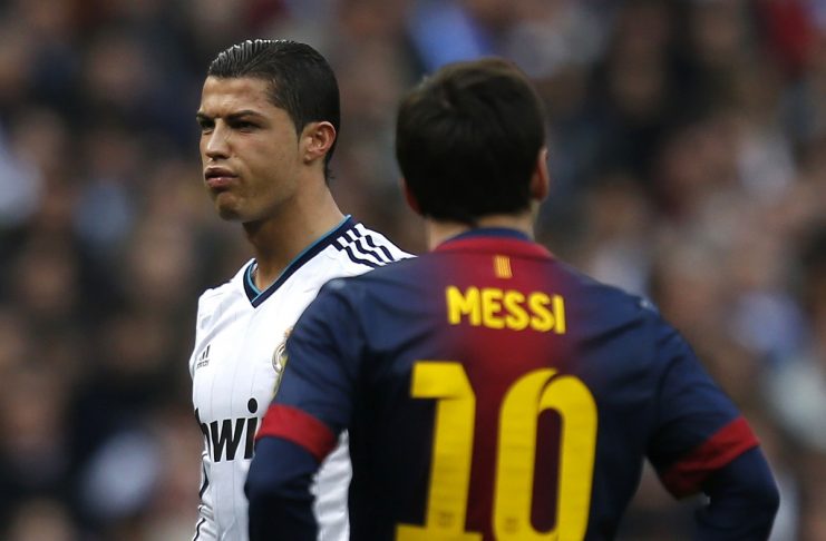 Barcelona’s Messi looks on as Real Madrid’s Ronaldo gestures during their Spanish first division “classic” match in Madrid