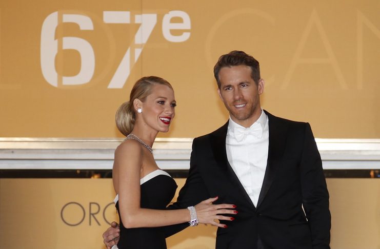 Cast member Ryan Reynolds and his wife actress Blake Lively pose on the red carpet as they arrive for the screening of the film “Captives” in competition at the 67th Cannes Film Festival in Cannes