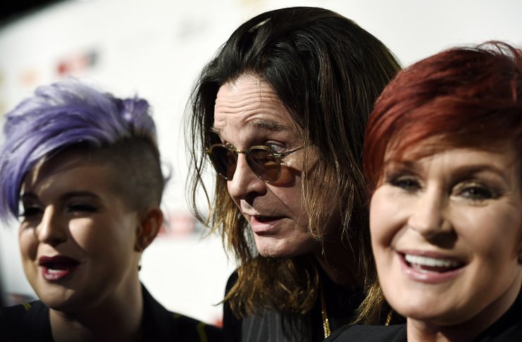 TV personality Osbourne and her parents Ozzy and Sharon react at the 10th anniversary of “Classic Rock Roll of Honour” awards in Los Angeles