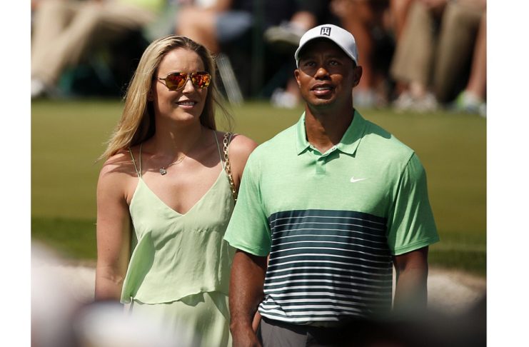 Skier Vonn stands next to her boyfriend U.S. golfer Woods during the par 3 event held ahead of the 2015 Masters at Augusta National Golf Course in Augusta