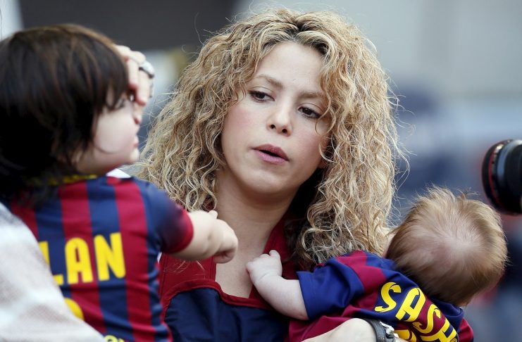 Singer Shakira holds her sons Sasha and Milan before the Spanish first division soccer match between Barcelona and Valencia at Camp Nou stadium in Barcelona