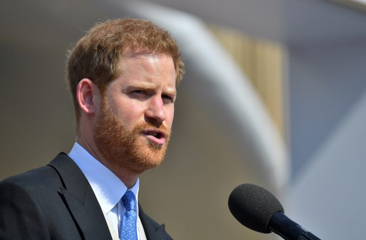 Britain’s Prince Harry speaks at a garden party at Buckingham Palace in London