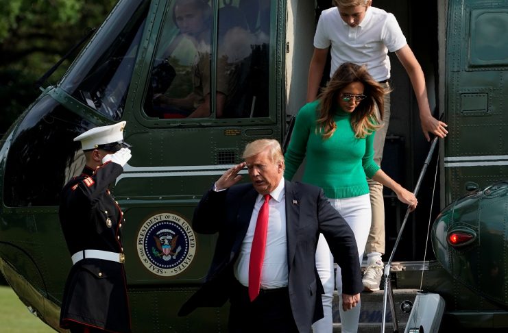 U.S. President Donald Trump and first lady Melania Trump return to the White House in Washington
