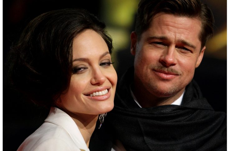 U.S. actor Pitt and his partner Jolie pose for photographers on the red carpet in Berlin