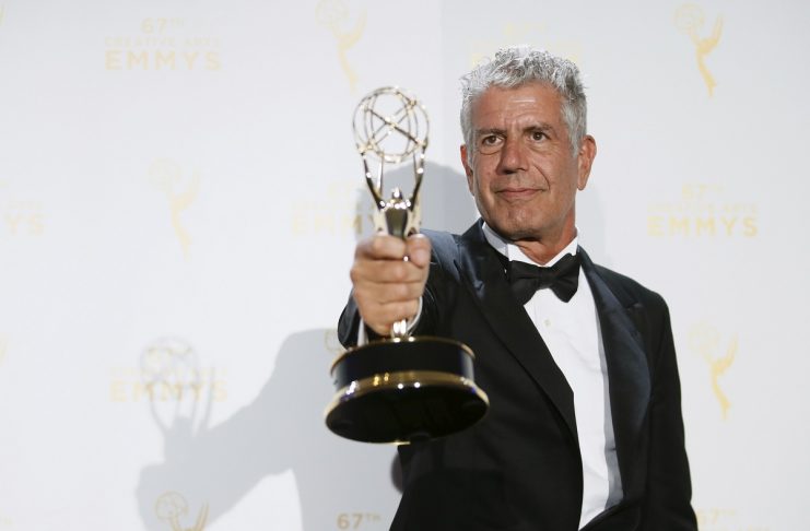 Anthony Bourdain poses with the outstanding informational series or special award for “Anthony Bourdain Parts Unknown” backstage at the 2015 Creative Arts Emmy Awards in Los Angeles