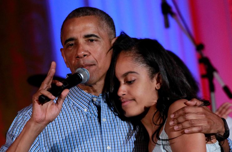 U.S. President Barack Obama congratulates his daughter Malia on her birthday during the Independence Day celebration at the White House in Washington