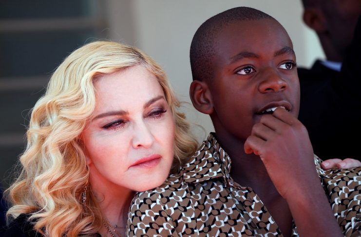 US singer Madonna embraces her son David Banda ahead of the opening of the Mercy James hospital in Blantyre