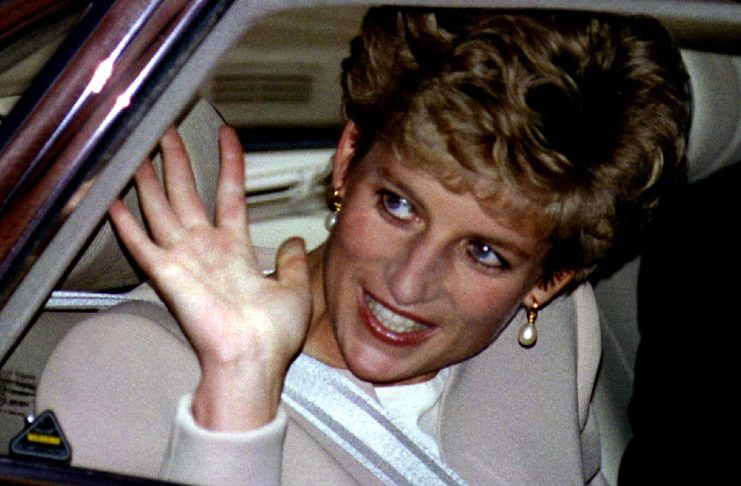 The Princess of Wales waves to cheering supporters as she leaves the Eating Disorders ’93 conference..