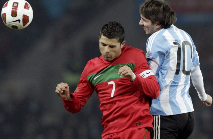 Portugal’s Ronaldo fights for the ball with Argentina’s Messi before their international friendly soccer match at the Stade de Geneve in Geneva