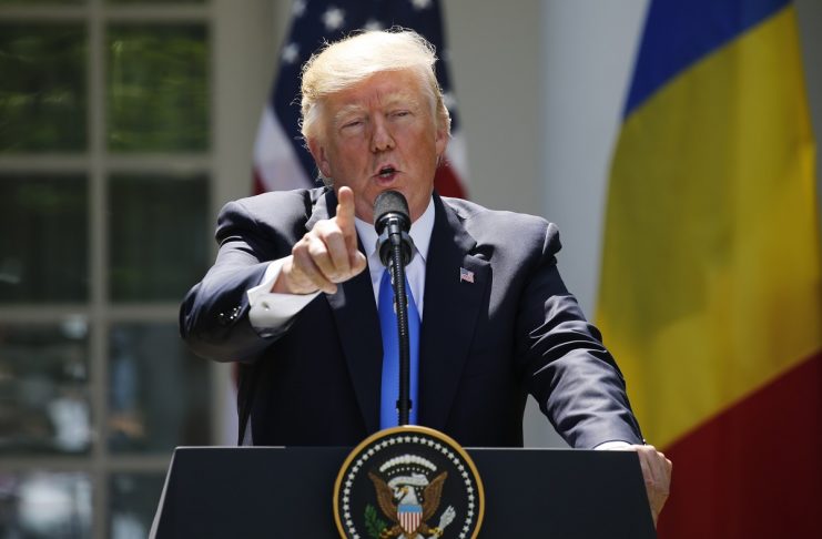 Trump reacts to a reporter’s question during a joint news conference with Romanian Iohannis in the Rose Garden at the White House in Washington