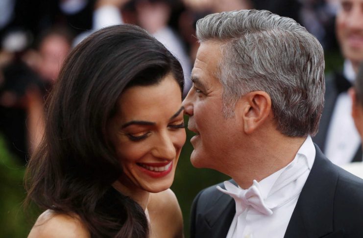 FILE PHOTO: George Clooney and wife Amal Clooney arrive at the Metropolitan Museum of Art Costume Institute Gala 2015 celebrating the opening of “China: Through the Looking Glass,” in Manhattan