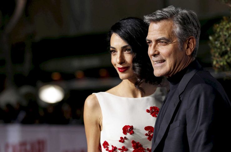 FILE PHOTO —  Cast member Clooney and his wife Amal pose at the premiere of “Hail, Caesar!” in Los Angeles