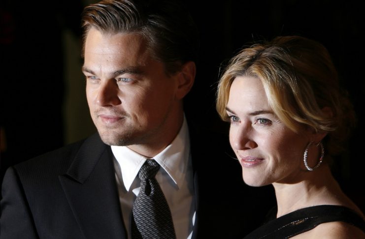 Actor Leonardo DiCaprio and actress Kate Winslet pose as she arrives for the European premiere of Revolutionary Road in Leicester Square in London