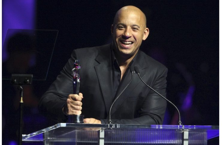 Actor Vin Diesel accepts his award for Action Star of the Year during CinemaCon in Las Vegas