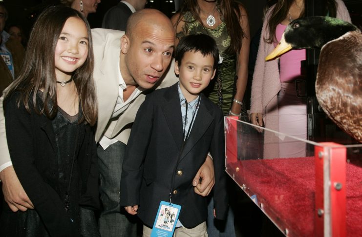 US actor Vin Diesel poses with his neice and nephew and Gary the duck at film premiere in Hollywood.