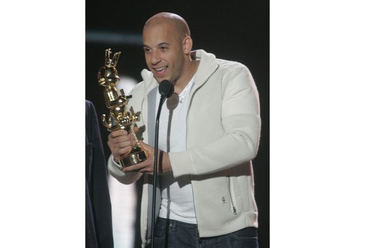 Actor Vin Diesle accepts award at Spike TV Video Game Award show.