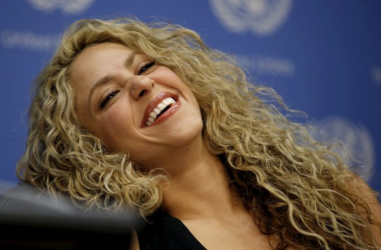 Colombian singer and UNICEF Goodwill Ambassador Shakira laughs during a news conference at United Nations headquarters in New Yor