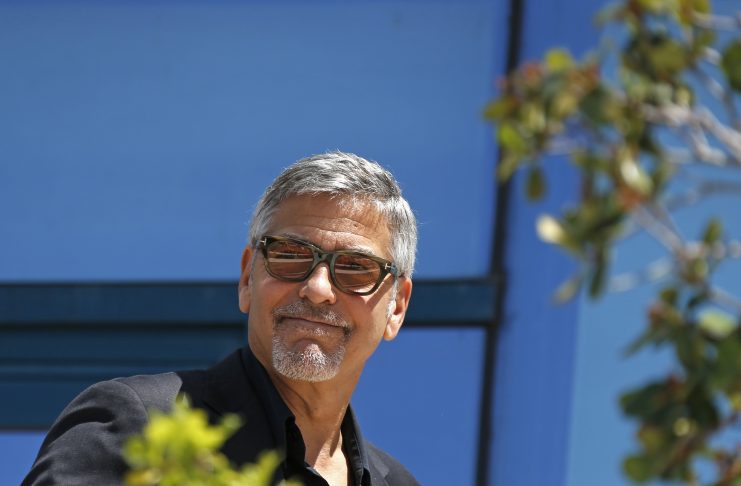 Cast member George Clooney arrives to attend a photocall for the film “Money Monster” out of competition during the 69th Cannes Film Festival in Cannes