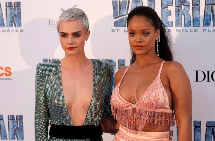 Cast members Rihanna and Cara Delevingne pose as they arrive for the premiere of the film “Valerian and the City of a Thousand Planets” in Saint-Denis