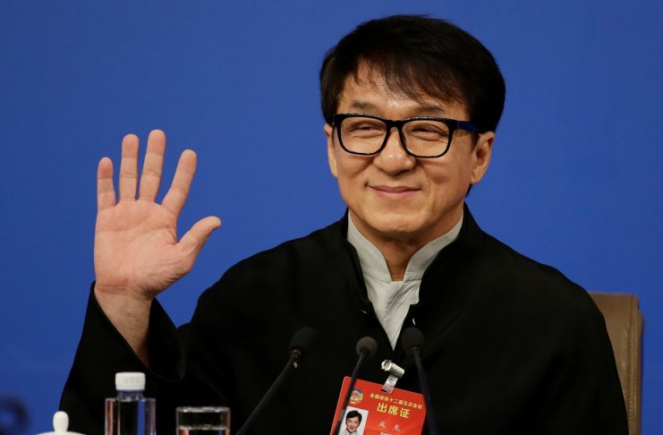 Hong Kong actor Jackie Chan, delegate of the CPPCC, attends a news conference in Beijing