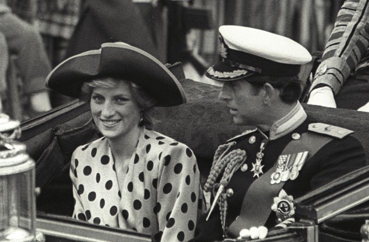 Prince Charles and Princess Diana ride in an open carriage from Buckingham Palace to Westminster Abbey