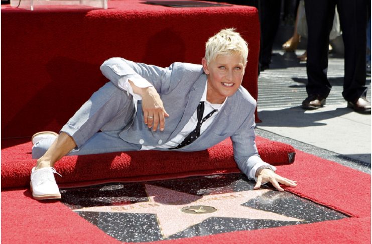DeGeneres poses by her star after it was unveiled on the Walk of Fame in Hollywood