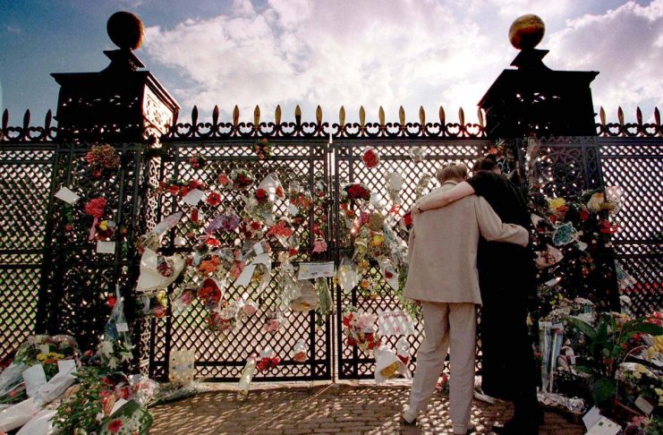 MOURNERS PUT FLOWERS ON THE GATES OF ALTHORP HOUSE