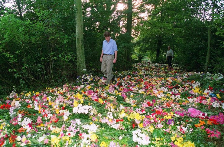 Earl Spencer, the brother of Diana Princess of Wales, walks through a carpet of flowers on the islan..