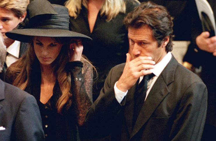 Imran Khan, accompanied by his wife Jemima, wipes his face during funeral of Diana, Princess of Wale..