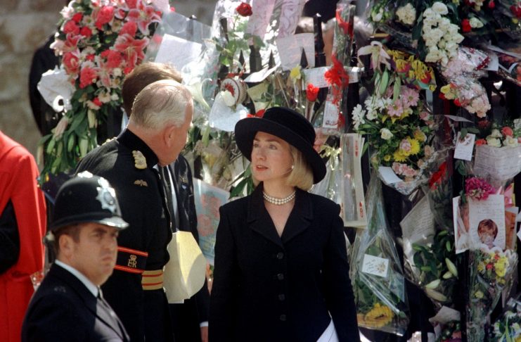U.S. First Lady Hillary Clinton views floral tributes after attending the funeral service of Diana, ..
