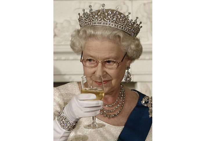 Queen Elizabeth II raises her glass at the White House in Washington