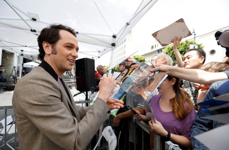 Actor Rhys signs autographs at the unveiling of the star for actor Keri Russell on the Hollywood Walk of Fame in Los Angeles