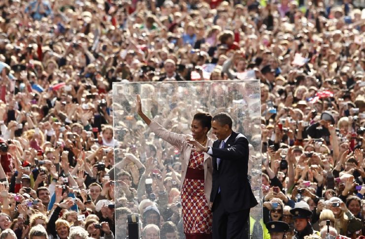 U.S. President Barack Obama and first lady Michelle Obama wave to well wishers at College Green in Dublin