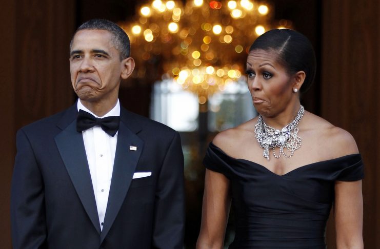 U.S. President Obama and first lady Michelle Obama react as car carrying Queen Elizabeth arrives in London