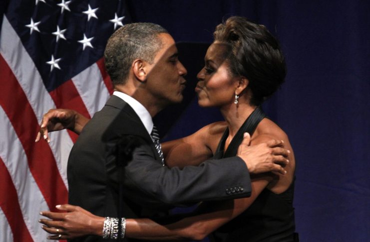 U.S. President Barack Obama kisses first lady Michelle Obama after she introduced him to speak at a fund raiser in New York