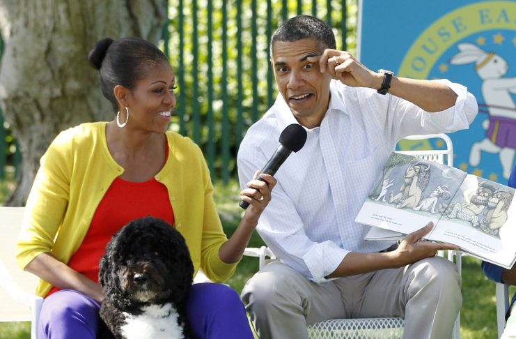 U.S. President Obama reads “Where the Wild Things Are” alongside first lady Michelle during White House Easter Egg Roll in Washington