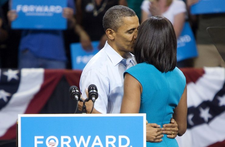 U.S. President Barack Obama kisses First Lady Michelle Obama during a campaign event at Virginia Commonwealth University in Richmond