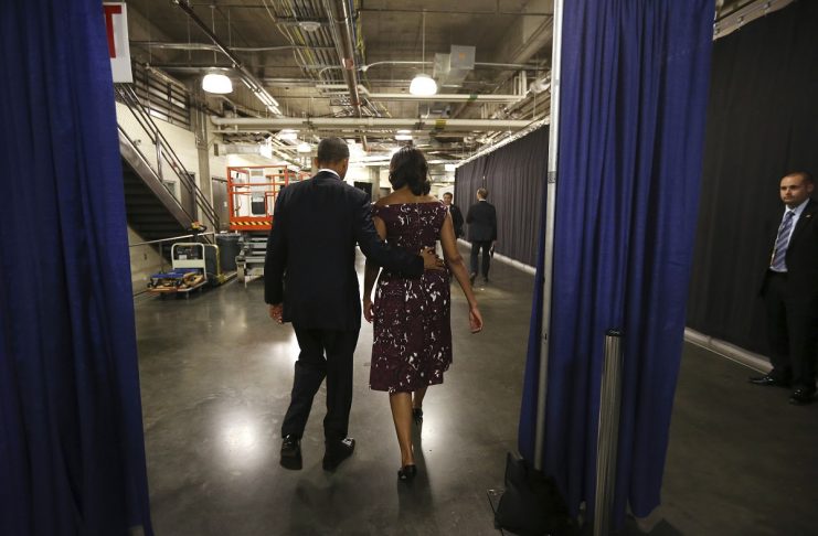 U.S. President Obama and First Lady Michelle walk to car following Obama’s speech at the Democratic National Convention in Charlotte