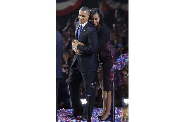U.S. President Obama is embraced by first lady Michelle Obama after his victory speech during his election night rally in Chicago