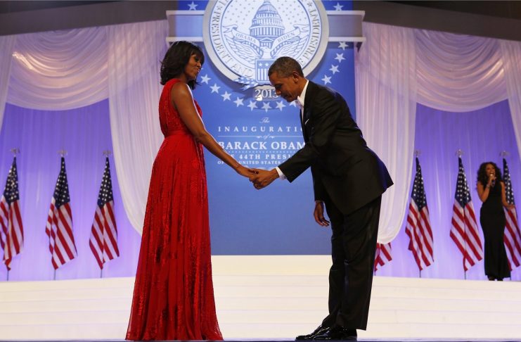 U.S. President Barack Obama bows to First Lady Michelle Obama at the Inaugural ball in Washington