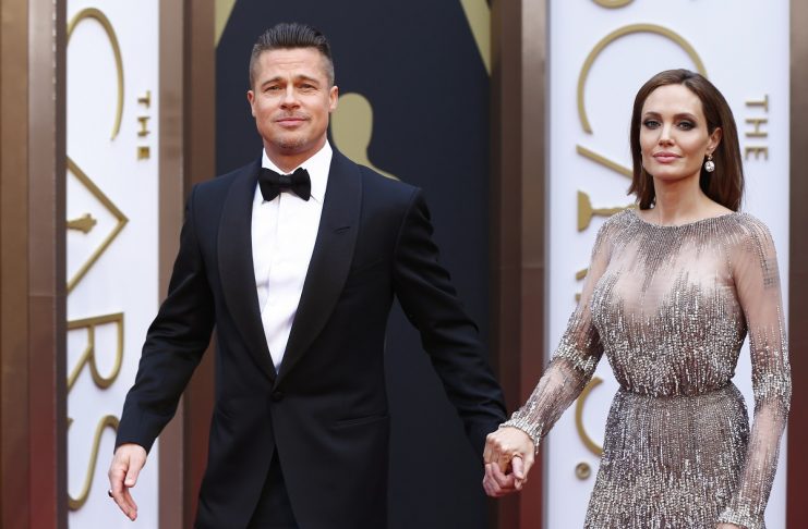 Actors Brad Pitt and Angelina Jolie arrive at the 86th Academy Awards in Hollywood, California