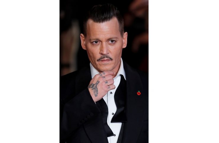 Johnny Depp arrives at the world premiere of Murder on the Orient Express at the Albert Hall in London