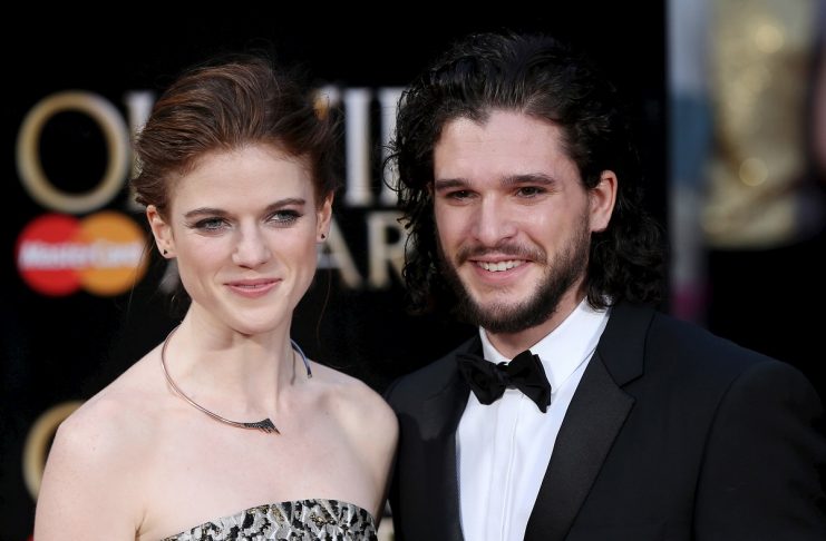 British actors Harington and Leslie pose for photographers as they arrive at the Olivier Awards at the Royal Opera House in London