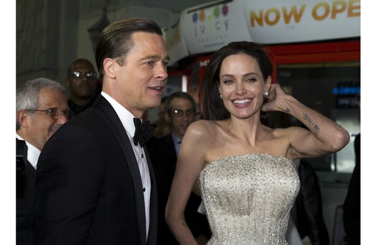 Director and cast member Jolie and her husband and co-star Pitt arrive at the premiere of “By the Sea” during the opening night of AFI FEST 2015 in Hollywood