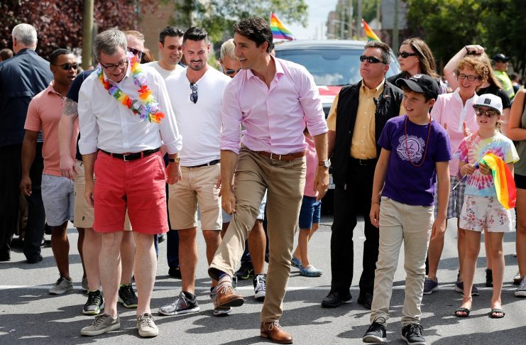Canada’s PM Trudeau shows off his socks while taking part in the Ottawa Pride Parade