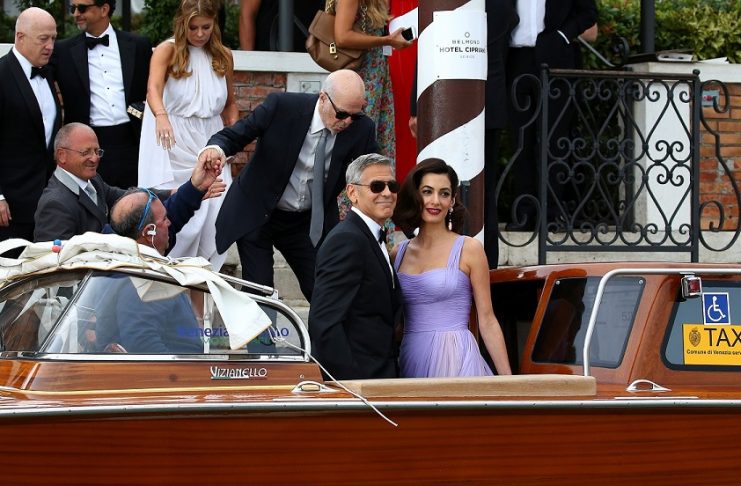 Actor and director Clooney and his wife Amal leaves the hotel before the red carpet for the movie Suburbicon at the 74th Venice Film Festival in Venice