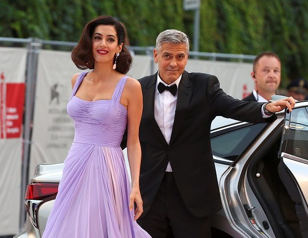 Actor and director George Clooney and his wife Amal arrive during a red carpet event for the movie “Suburbicon” at the 74th Venice Film Festival in Venice, Italy
