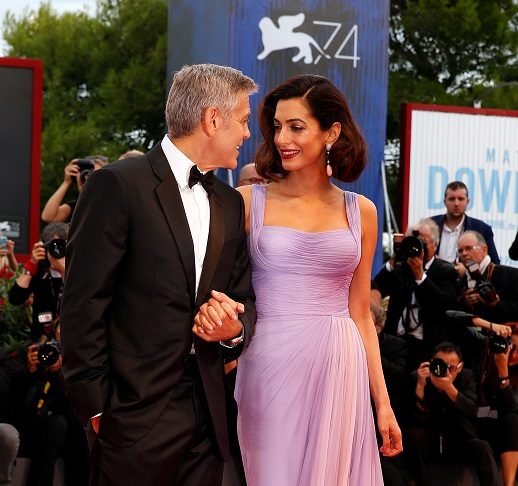 Actor and director George Clooney and his wife Amal pose during a red carpet event for the movie “Suburbicon” at the 74th Venice Film Festival in Venice, Italy